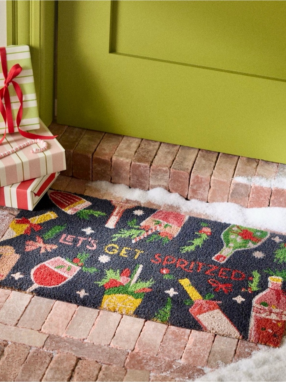 Anthropologie Let's Get Spritzed Coir Printed Doormat playful holiday pattern